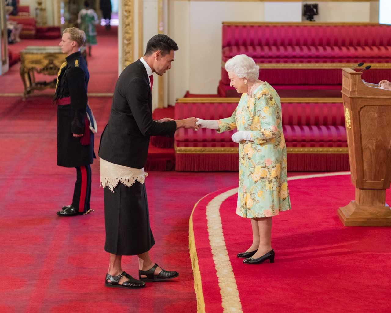 Joshua Sefesi meeting the Queen