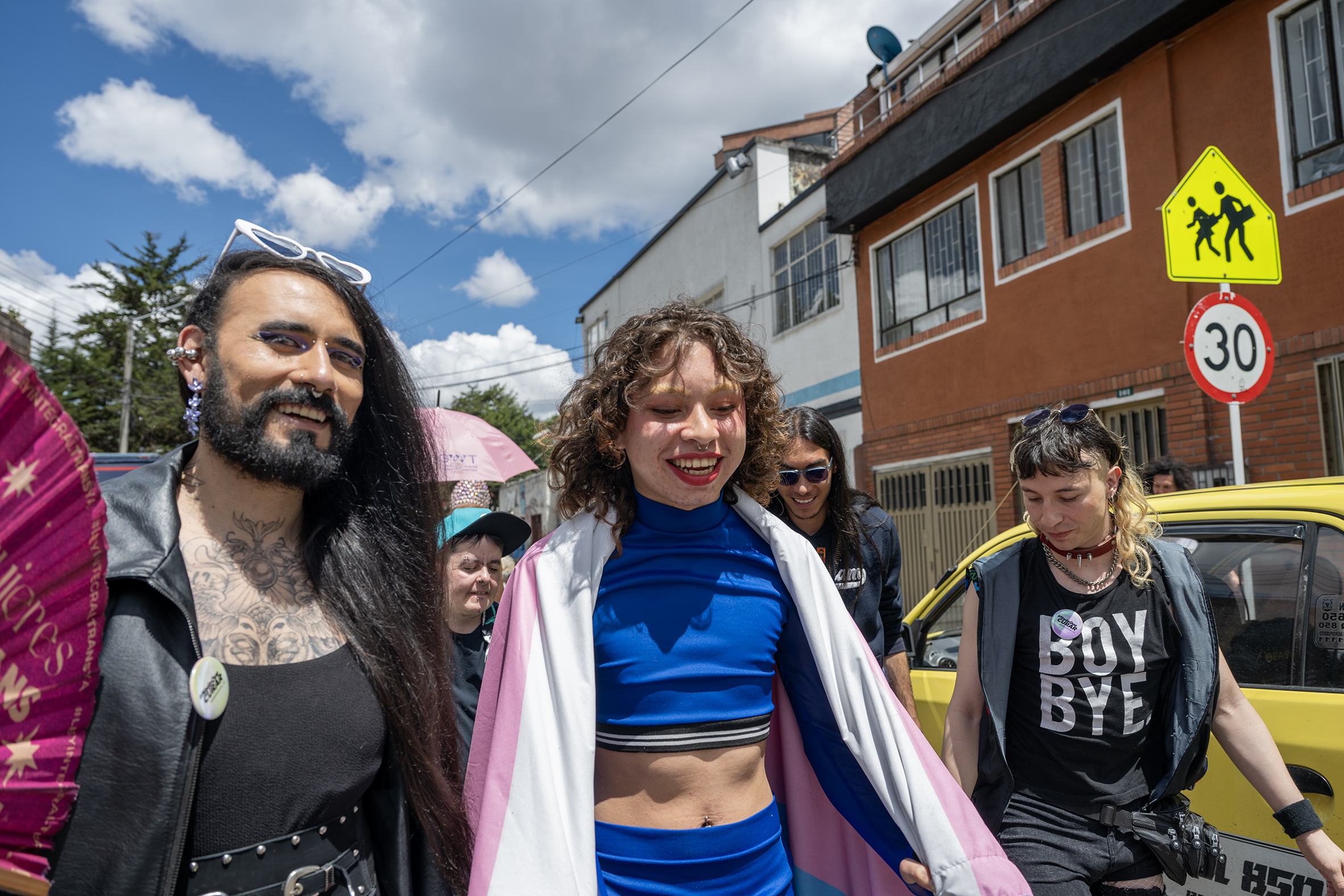 Members of the trans community in Colombia walk with pride in a street on Bogota