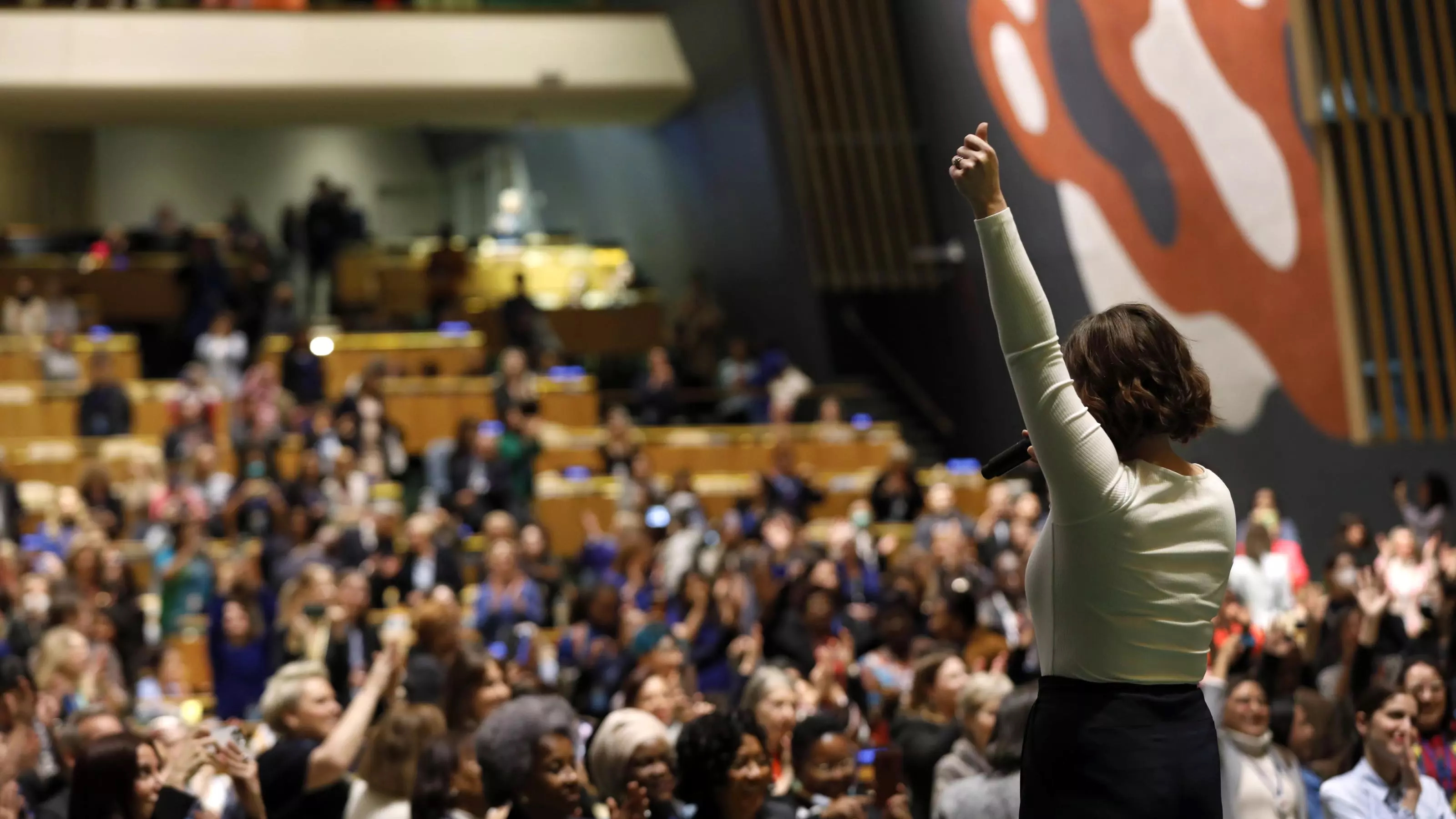 Women stands with her back to the camera before the chamber at CSW.