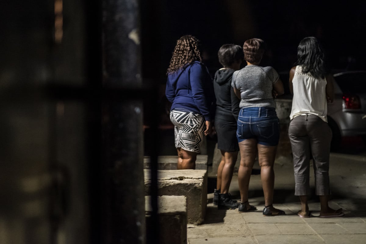 A group of sex-workers wait for clients near a complex of bars in Selebi Phikwe, Botswana.