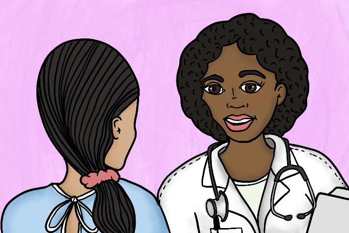 A healthcare professional talks with a patient