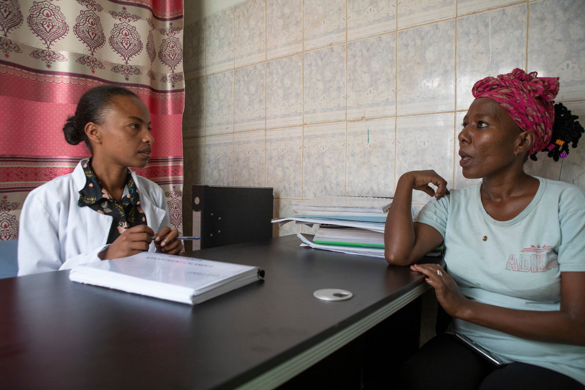 Emebet Bekele is a former sex worker turned counsellor in her office with a patient