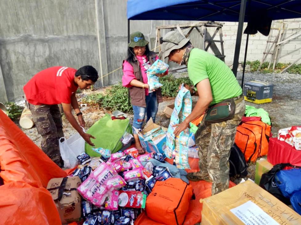 The team preparing the dignity kits for distribution 