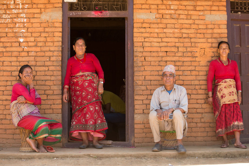 Group of people outside their home