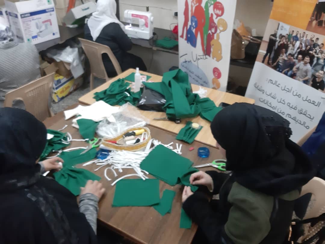 Volunteers at one of SFPA's centers making masks for staff