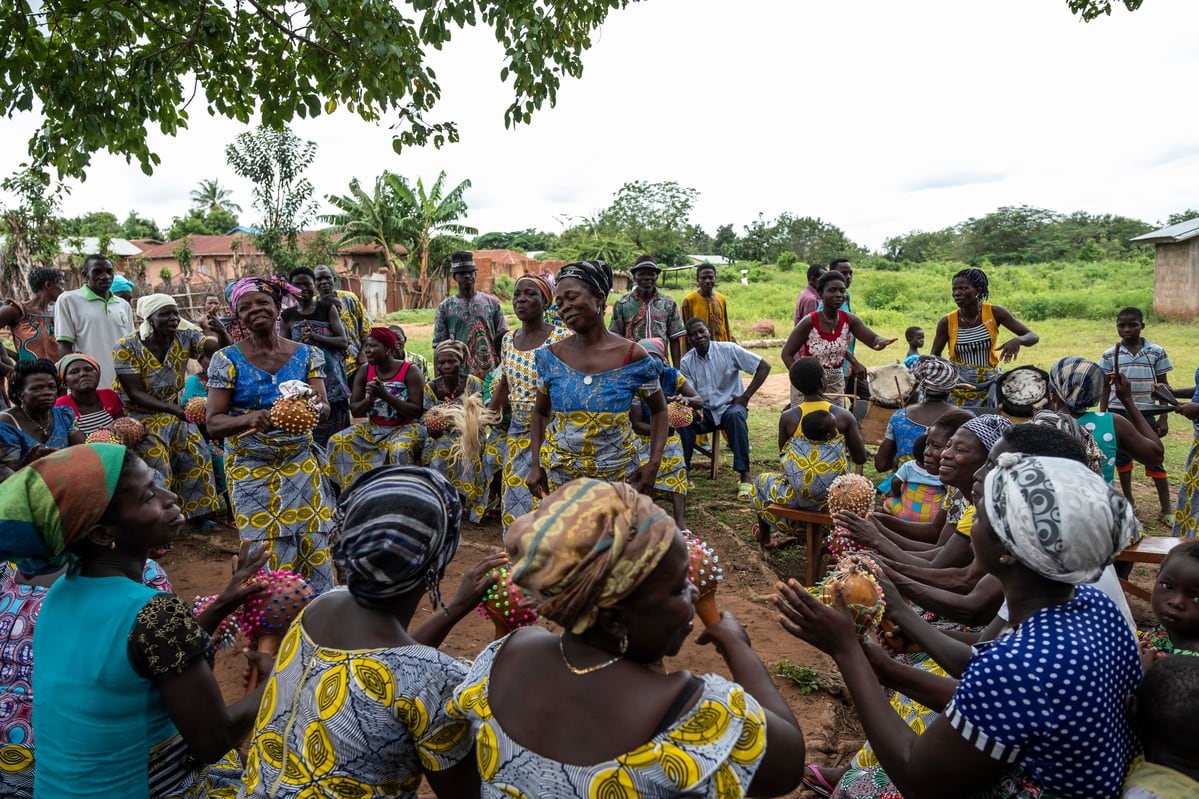 Villagers attend a talk by ATBEF staff about family planning and contraception in Kpei village.
