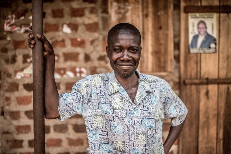 Man standing outside his home.