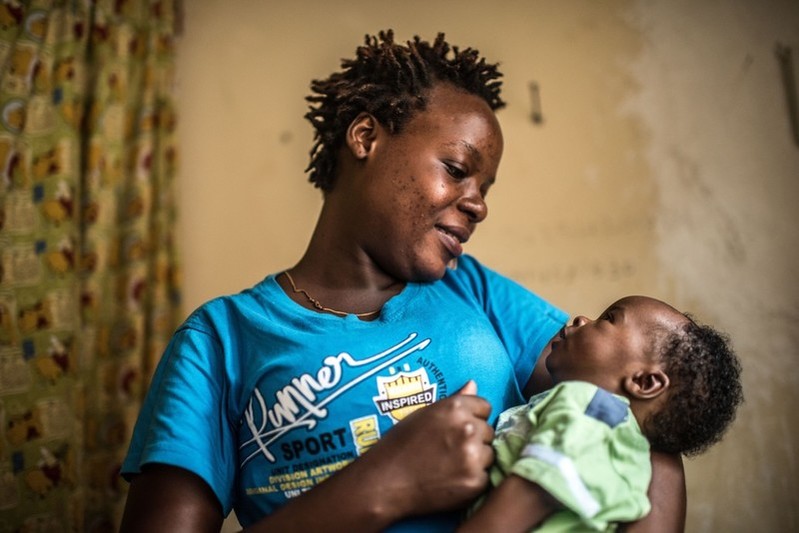 Masiturah with her baby at home in Kampala.