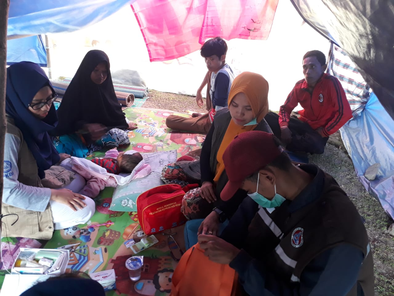 Treatment of a woman affected by the natural disasters in Indonesia
