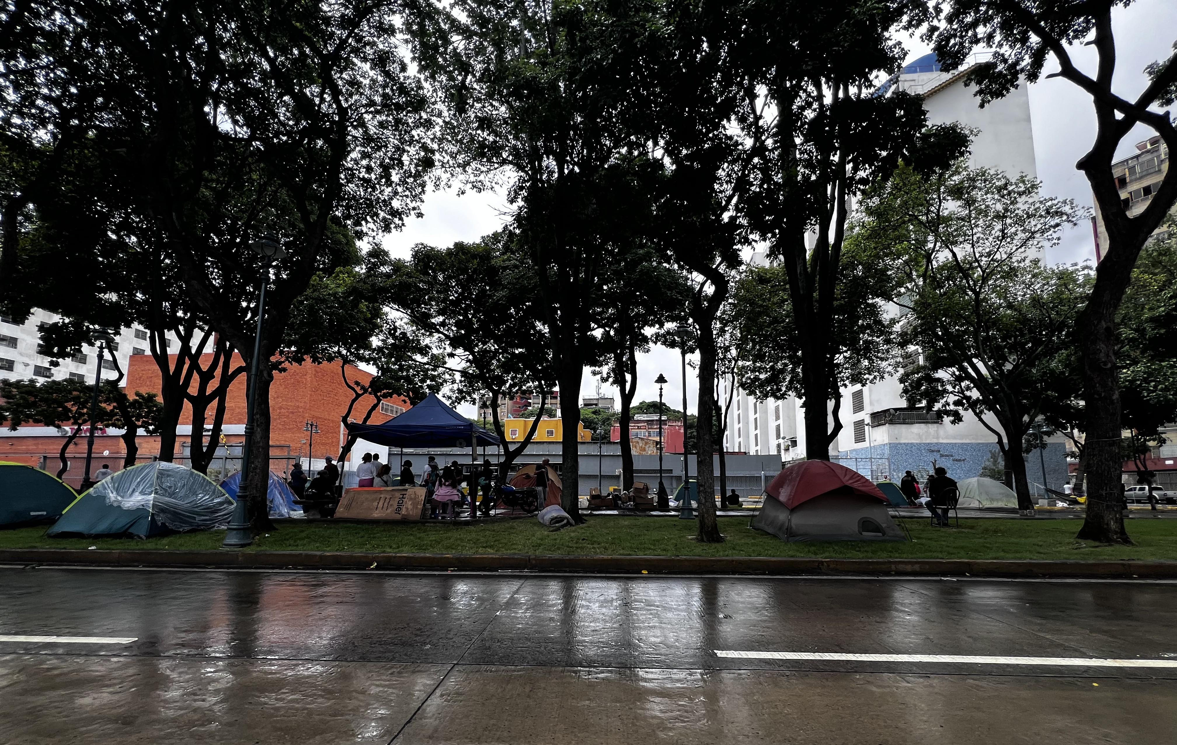Tents in a row along a rainy street in Venezuela