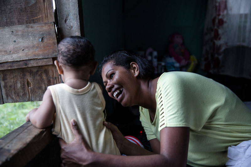 22 year old, Sulueti with her son in Nanukuloa village in Ra Province. She received a dignity kit from IPPF and received baby supplies for post-delivery, everything that was required for a new mother to care for a baby was in the kit. 