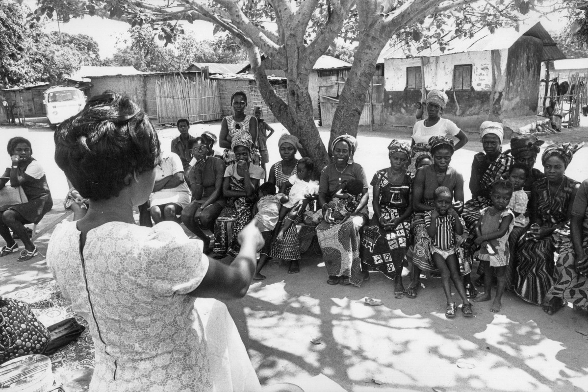 Family planning health workers giving a talk to a local community on contraception. Ghana, 1976