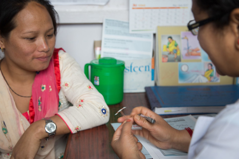 Maya Thapa married for 18 years with two children, discussing Intrauterine contraceptive device with counsellor at the Tansen FPAN clinic.