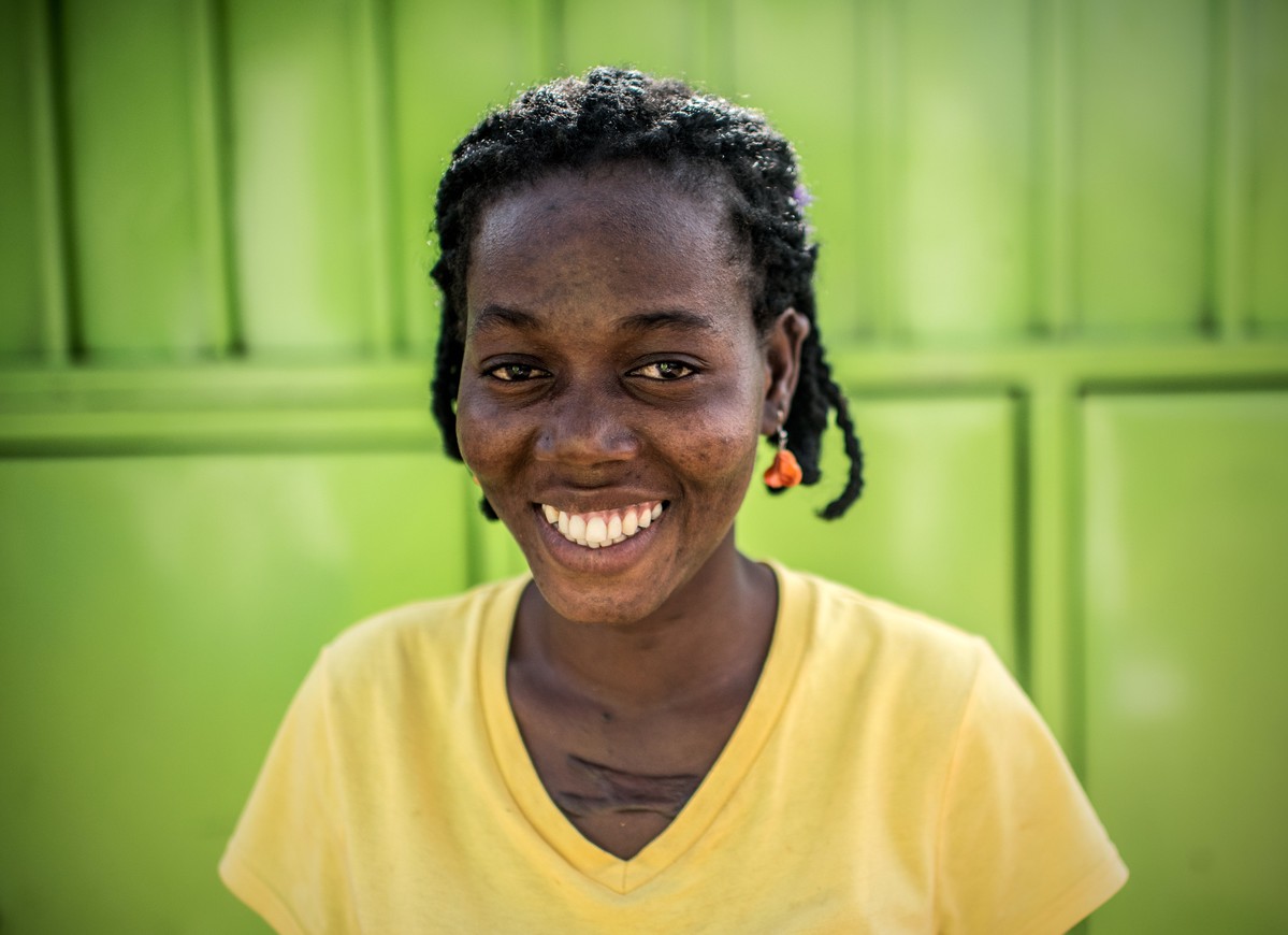 Monica, smiles after testing negative for HIV and other STIs at the RHU clinic in Gulu, Uganda.