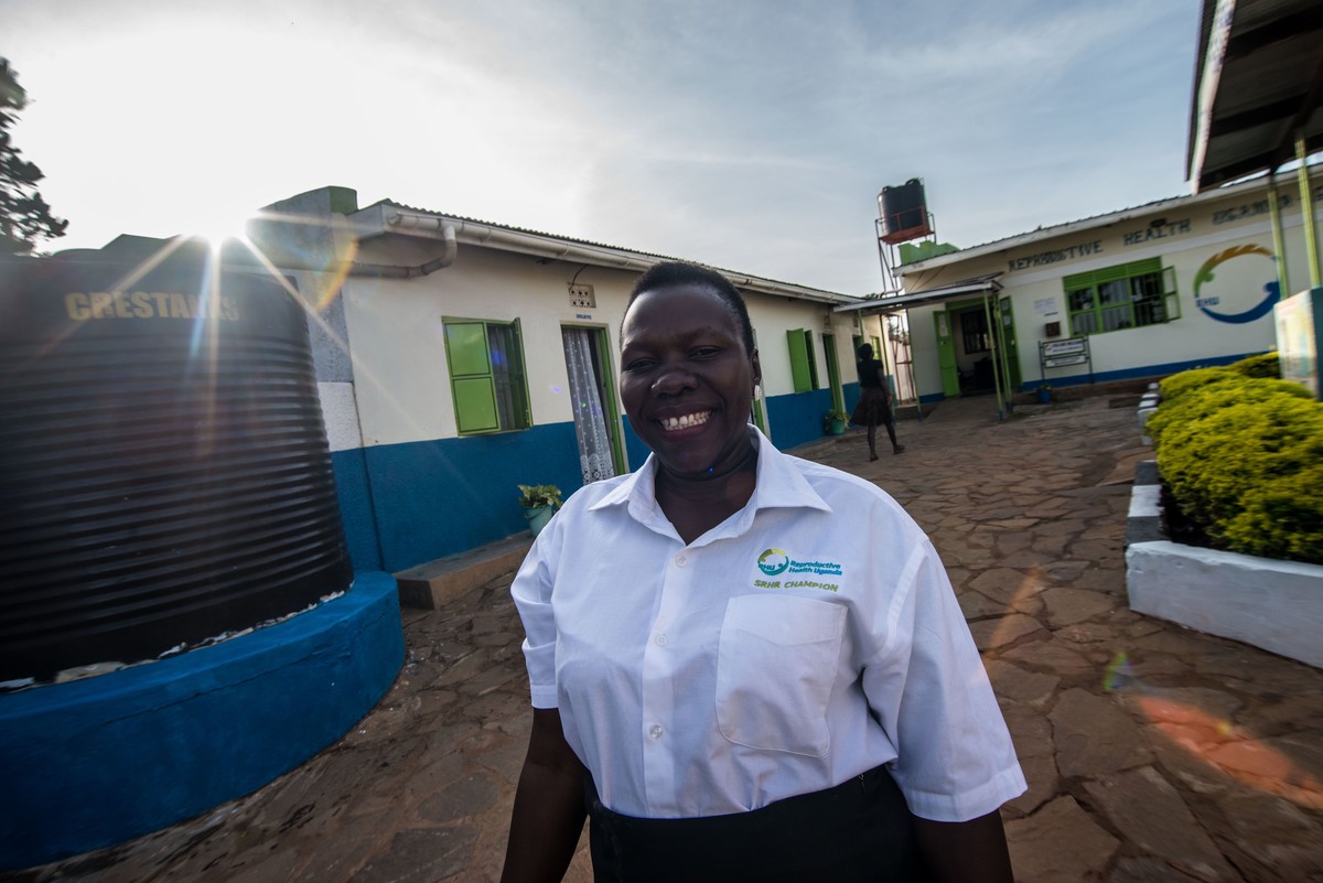 Anishia welcomes clients at RHU's Gulu Clinic. Uganda, 2016