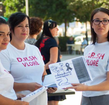 Youth volunteers handing out information on sexual & reproductive healthcare in Albania.