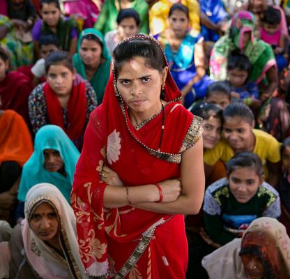 Indian woman standing with arms crossed