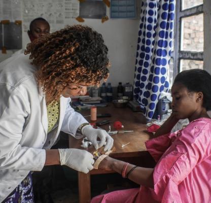 Dr Nyamalibu supports a client