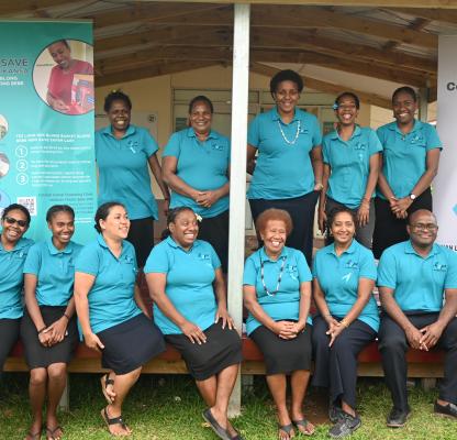Clinic staff in front of the clinic