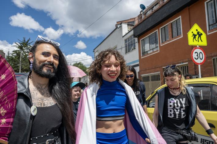 Members of the trans community in Colombia walk with pride in a street on Bogota