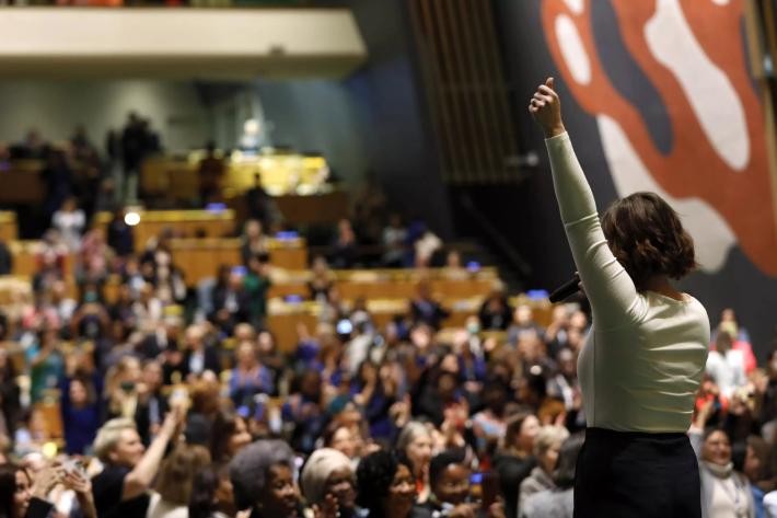 Women stands with her back to the camera before the chamber at CSW.