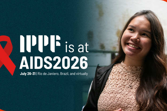 IPPF at AIDS2026 grey banner with activist