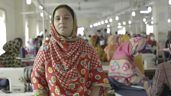 Jasmin at the garment factory where she works