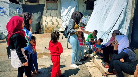women and children in a refugee camp