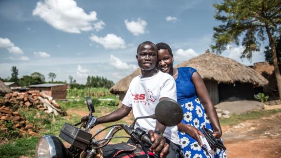 Husband and wife, clients, outside IPPF outreach clinic in rural Uganda