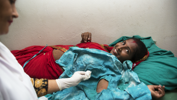 Muna receiving her implant