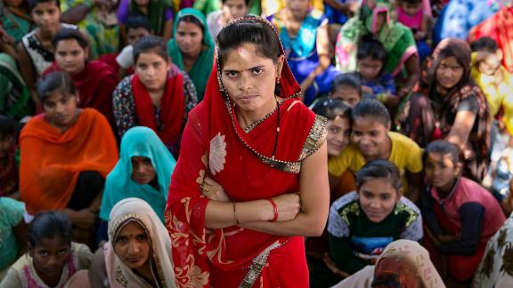 woman standing with arms folded - India