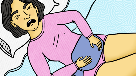 A woman in distress with a hot water bottle over her tummy
