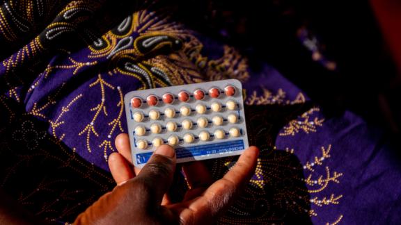 Client holing the pill.