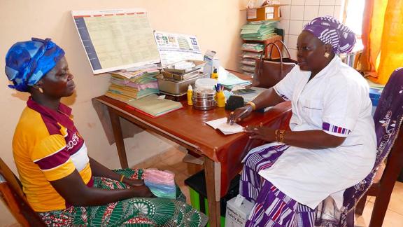 Healthcare worker and client. 