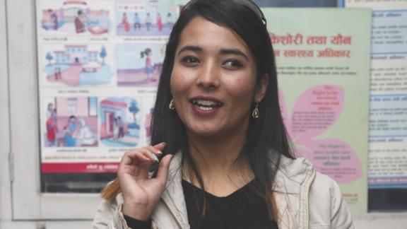 A photo of Sanjiya Shrestha speaking