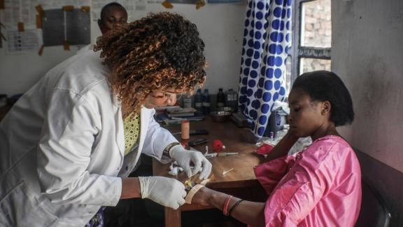 Dr Nyamalibu supports a client