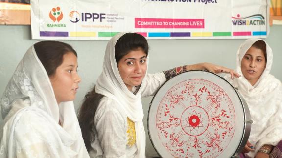 A woman smiles during a youth session