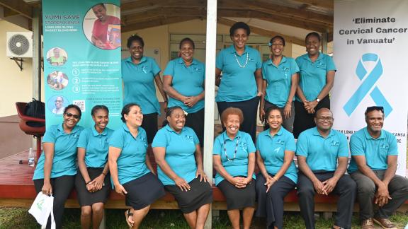 Clinic staff in front of the clinic