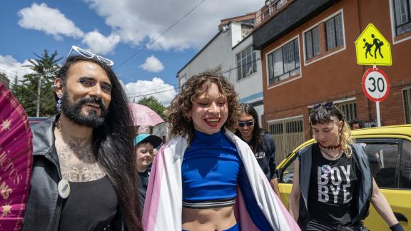 Members of the trans community in Colombia walk with pride in a street on Bogota