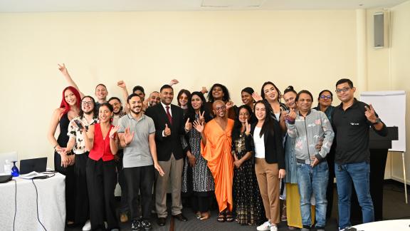 Group photo against a cream background of participants from the trans activists and leaders gathering in Sri Lanka. 