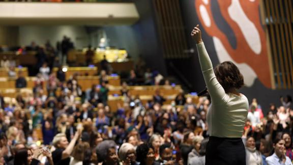 Women stands with her back to the camera before the chamber at CSW.