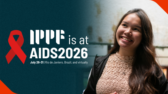 IPPF at AIDS2026 grey banner with activist
