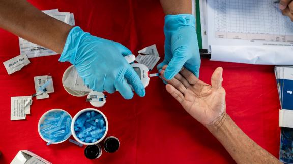 medic carries out a blood test following Typhoon