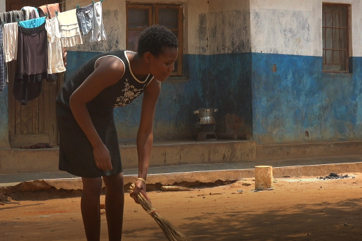 Mary Sinoya doing her daily chores after school