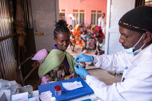Trahas visiting the clinic's lab for some tests.