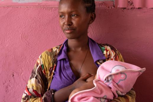 Trahas with her 3-month year old baby girl in the clinic.